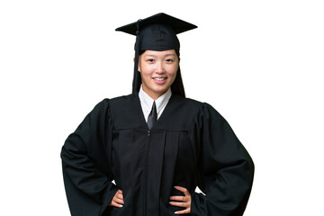 Young university graduate Asian woman over isolated background posing with arms at hip and smiling