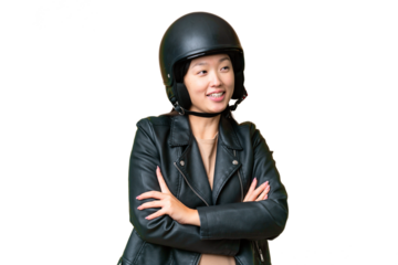 Young Asian woman with a motorcycle helmet over isolated chroma key background happy and smiling