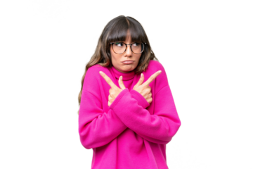 Young caucasian woman over isolated background pointing to the laterals having doubts