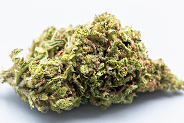 Detailed view of dried cannabis bud with trichomes on light background, perfect for medical,...