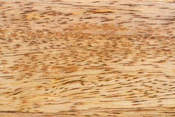 Mango wood texture top view. Kitchen wooden tray background, organic Mangifera indica veneer