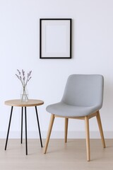 Minimalist Interior Scene Featuring a Light Grey Upholstered Chair and a Round Wooden Side Table with Lavender