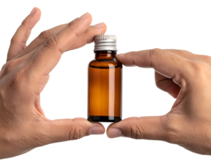 hands_holding_small_amber_glass_bottle_with_silver_cap_on_isolated_white_background