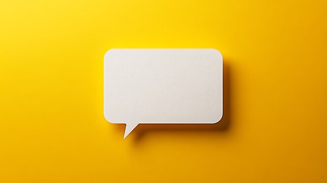 Blank white speech bubble on vibrant yellow background for message or creative design