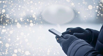 Digital Winter Dialogue: A person, wrapped in cozy winter gloves and coat, is holding a sleek mobile phone, typing a text message into the device as gentle snowflakes fall in the cold, snowy setting.