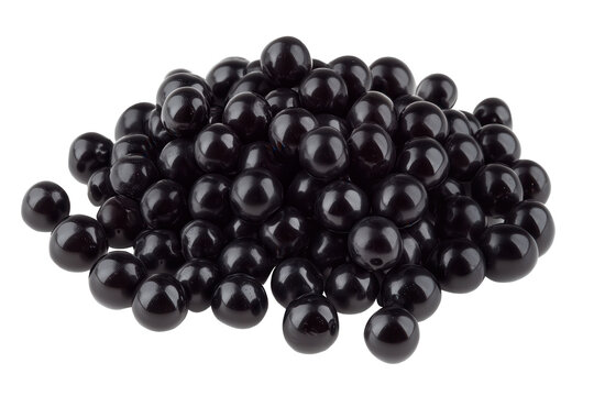 Black tapioca boba pearls piled together on a transparent background for food and beverage preparation or decoration purposes