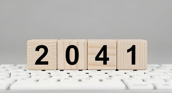 Year forecast concept showing wooden blocks with number for year twenty forty one on keyboard