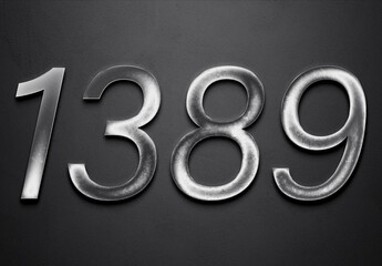 Chrome metal 3D number design of 1389 on grey background.