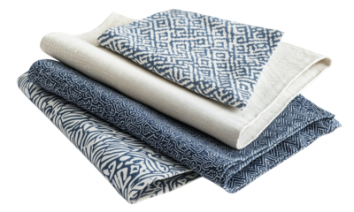 Stacked patterned fabrics showcase intricate designs and textures, displaying a variety of colors and styles. isolated on white background and transparent background