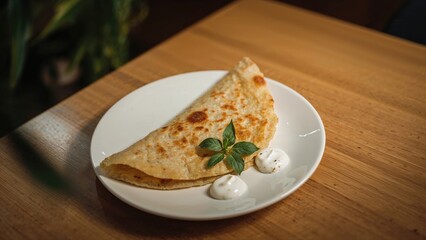 Dish with thosai photographed using a smartphone.