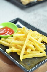 Plates of French fries with ketchup, a mesmerizing of crispy, golden and highlighting each fry's perfect texture and irresistible appeal