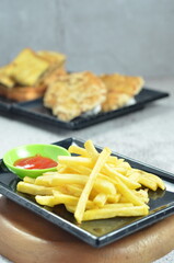 Plates of French fries with ketchup, a mesmerizing of crispy, golden and highlighting each fry's perfect texture and irresistible appeal