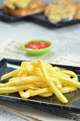 Plates of French fries with ketchup, a mesmerizing of crispy, golden and highlighting each fry's perfect texture and irresistible appeal