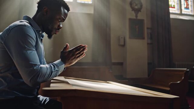 close up african american man prayer in church hope