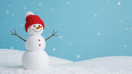 Fototapeta premium Single small snowman wearing a hat on a chilly blue and white backdrop during winter.