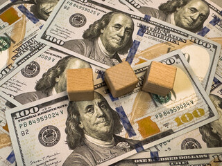 Dollars banknote and word Job. Banknotes and wooden cubes. Job Concept with wooden blocks and money.