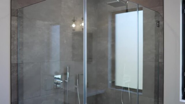 A close-up view shows a bright, neutral-toned interior space with a vertical line dividing the wall, creating a minimalist aesthetic.