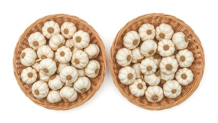 A duo of woven baskets holding fresh garlic, set on a white background to promote wholesome ingredients and food preparation.
