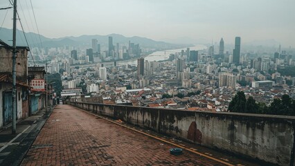 Fototapeta premium Empty brick floor providing a vantage point to the city skyline and urban scenery