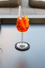 glass of Aperol Spritz cocktail im Garten
