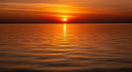 Serene Sunset Over Calm Water with Vibrant Orange and Red Sky