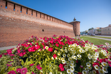 Old Kremlin red brick wall with tower on sunny summer day, Kolomna, Russia