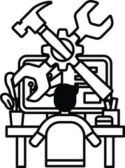 A man is sitting at a desk with a computer and a toolbox