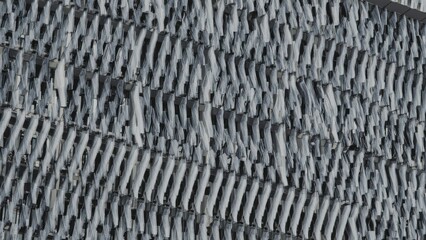 Contemporary building exterior featuring panel shutters forming a monochrome grid pattern, abstract design, urban office, texture, art, and sky elements