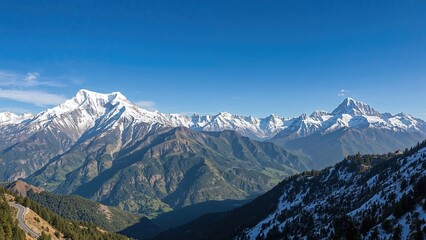 Panoramic vista of the great Himalayan range from a mountain road, featuring Mount Bandarpunch and the Gangotri range