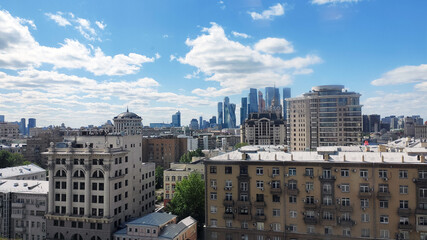 Historic architecture blends with glass skyscrapers, merging residential charm and modern office...