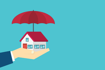 House under red umbrella on a human hand. Property insurance concept. Protection from disaster. Home security, safety, secure investment, repair coverage.