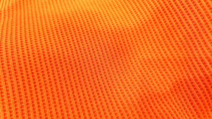 Obraz premium Close-up view of an orange textured fabric.