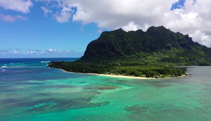 Fototapeta premium Coastal landscape with a dramatic mountain backdrop.