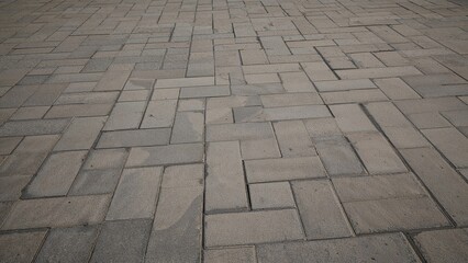 Fototapeta premium Background featuring a patterned concrete paver block floor