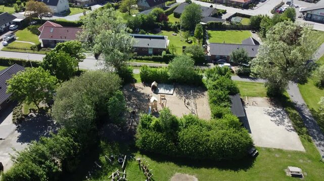 Drone shot of a playground in a small danish village.