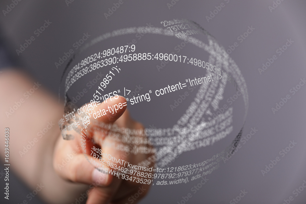 Poster a hand interacts with a futuristic, transparent hologram displaying lines of code, representing digi