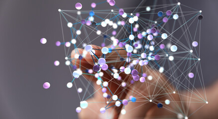 Abstract image of a hand interacting with a complex network of interconnected nodes.