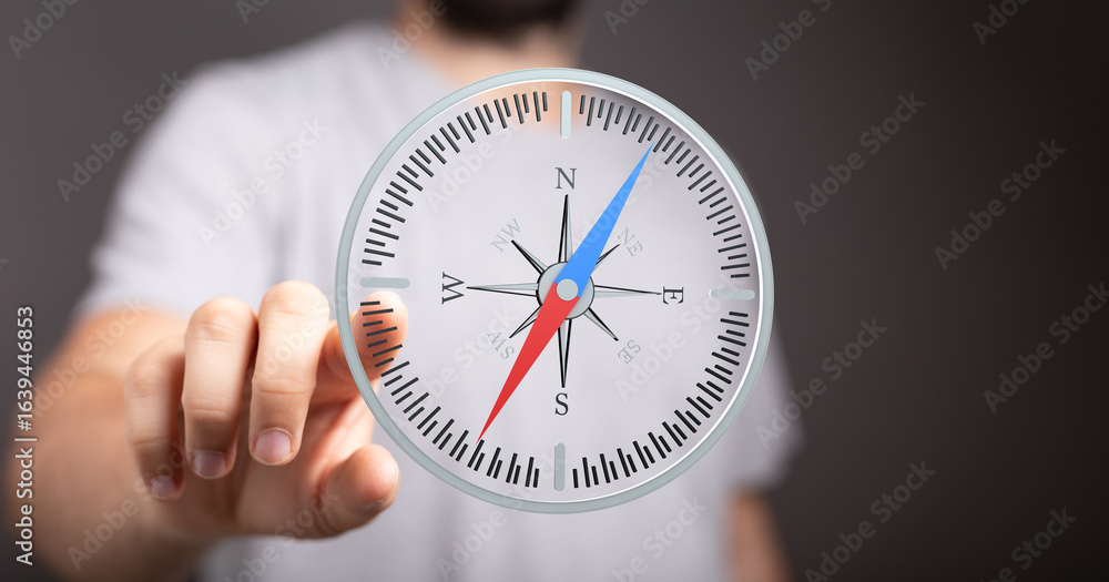 Poster close-up of a man interacting with a virtual compass, symbolizing guidance, direction, and decision-
