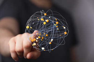 A hand interacts with a digital sphere, showcasing global network connections and data...