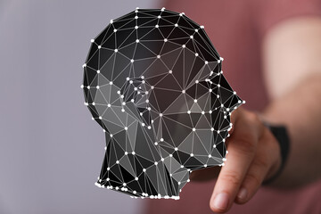 Abstract polygonal head graphic.  Represents AI, neural networks, technology, and data.