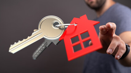 Close-up of house keys and red house keyring.  Perfect for real estate, home buying, or new home concepts.