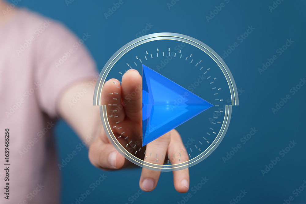 Poster abstract image of a hand interacting with a digital play button. perfect for technology, media, and 