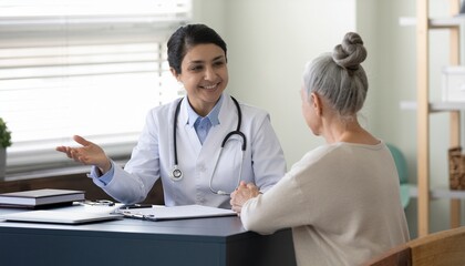 Fototapeta premium Doctor Consulting Senior Patient: Healthcare and Wellness