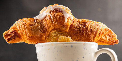 Croissant almond freshly baked sweet dessert tasty snack fresh delicious gourmet food background on...