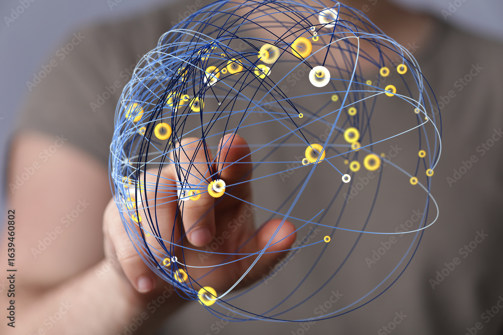 Poster abstract image of a hand interacting with a digital sphere representing global network connections.