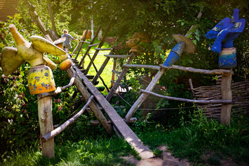 Beautiful Ukrainian countryside. Old wooden bridge over the spring