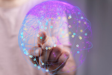 Hand interacts with a vibrant digital globe, showcasing global connectivity and networking.