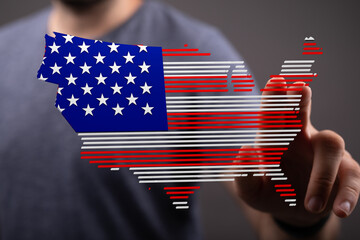 Person interacts with a digital map of the USA, flag design.  Technology, nation, digital.