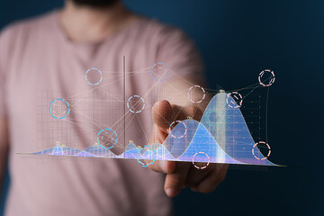 A businessman interacts with a digital graph showcasing data analysis and business insights.