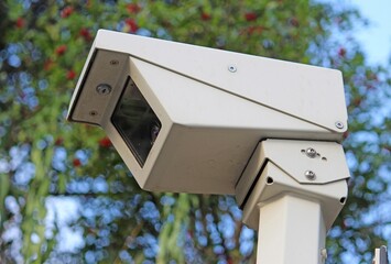 Outdoor surveillance camera on a pole, side on